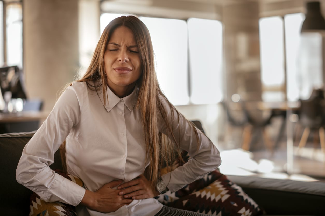 Woman with a stomach ache.