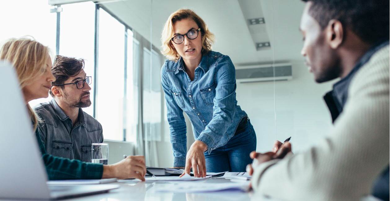 A leader in the workplace explaining her business plan