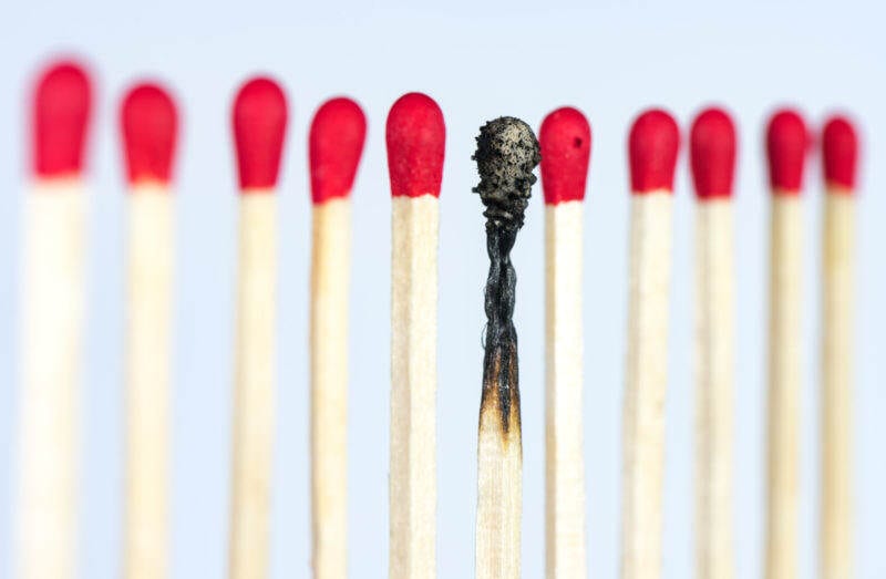 Line of matches with the middle one burnt out
